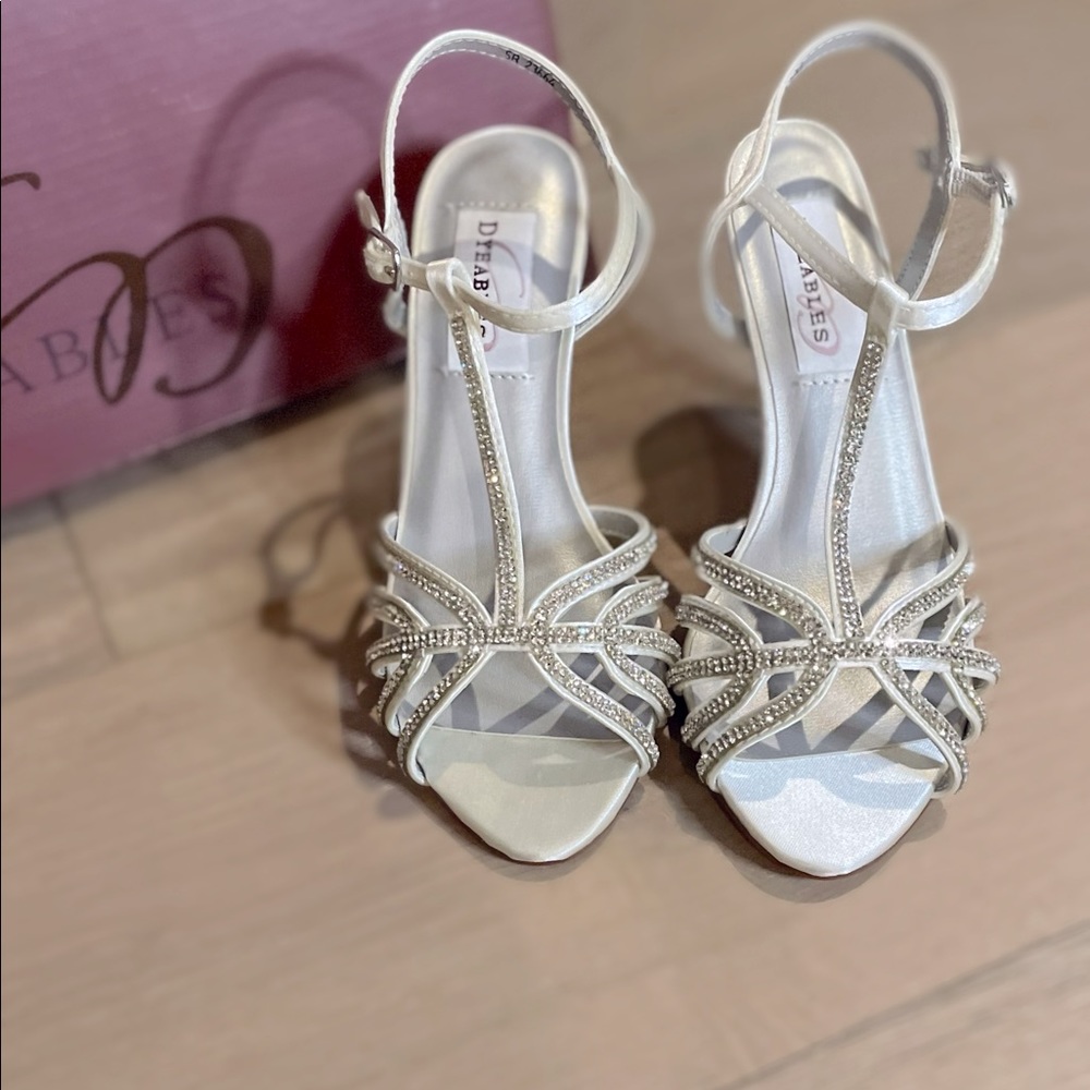 Brand new in box w/tags size 5.5 white/silver crystal lined strapped heel